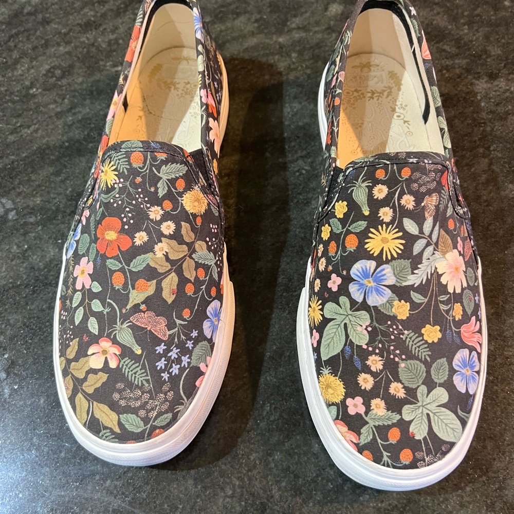 Lightly worn Keds slip ons with floral canvas print, size 11